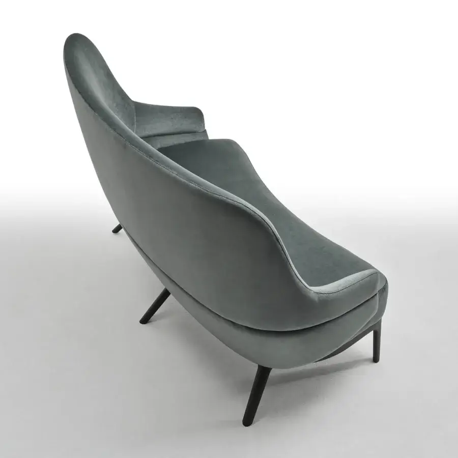 Elegant Zanaboni Kore sofa handcrafted in Italy with curved silhouette and matte textile upholstery