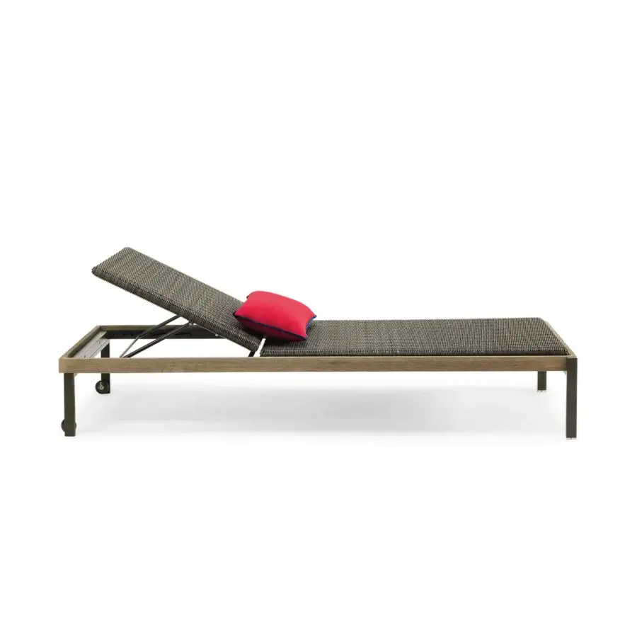 Superior Ethimo Allaperto lounger built with gray-brown woven textile and vibrant pink cushion with blue trim in a dark matte finish