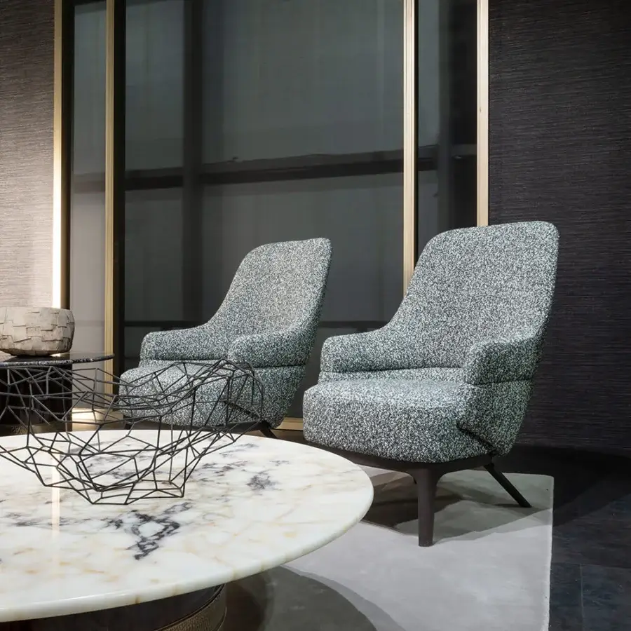 Exceptional Zanaboni Kore lounge chair with textured muted gray textile upholstery and satin-finish tapered wooden legs