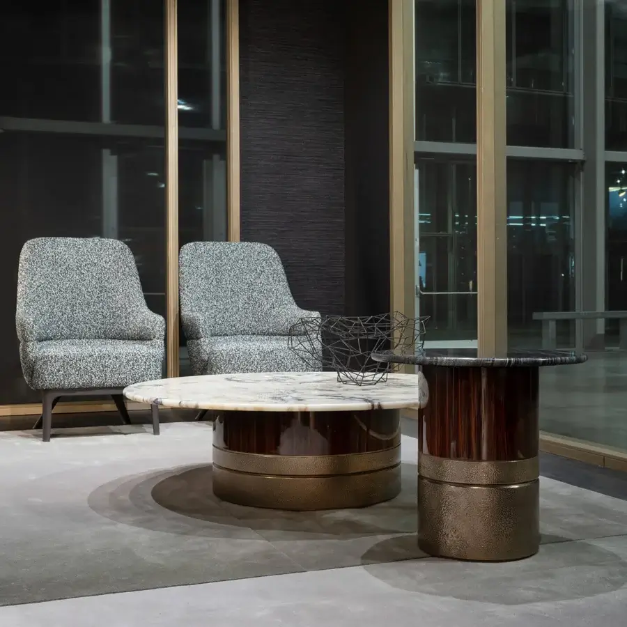 Elegant Zanaboni Kore lounge chair with muted gray textile material and solid wooden base in matte finish