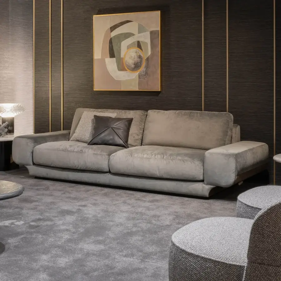 Elegant Zanaboni Milo sofa with gently curved form and subtly textured gray textile upholstery featuring striking aluminum detail