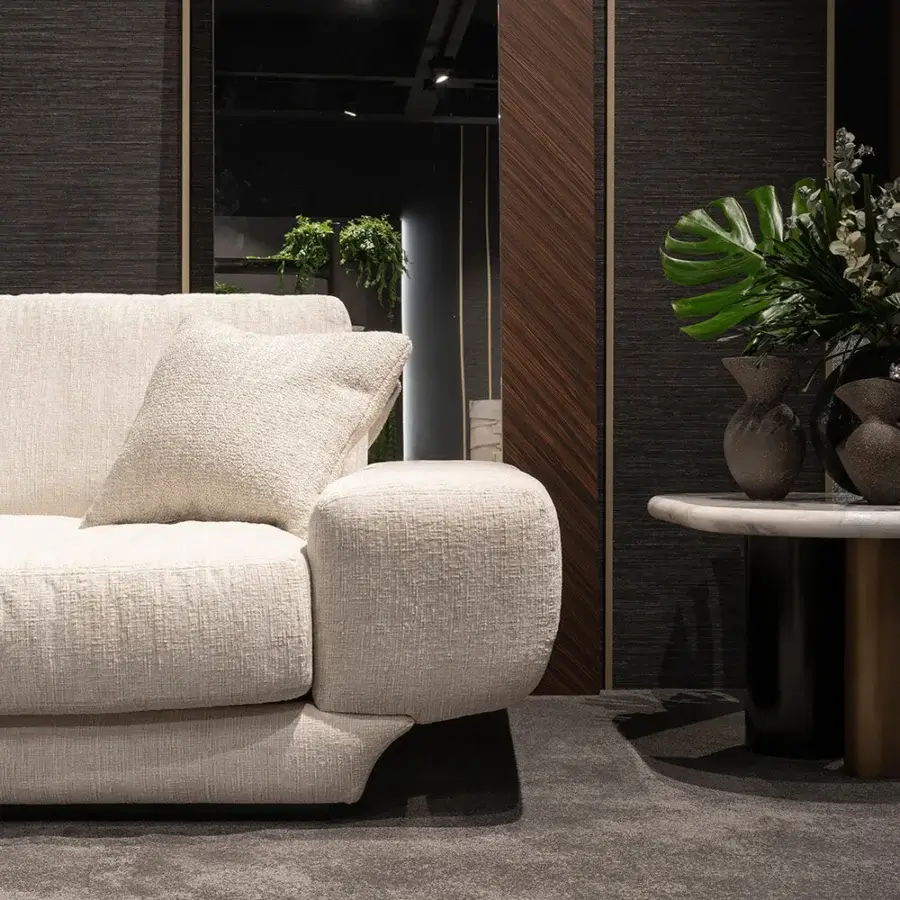 Superior Zanaboni Milo sofa with woven beige textile and subtle aluminum detailing around armrests