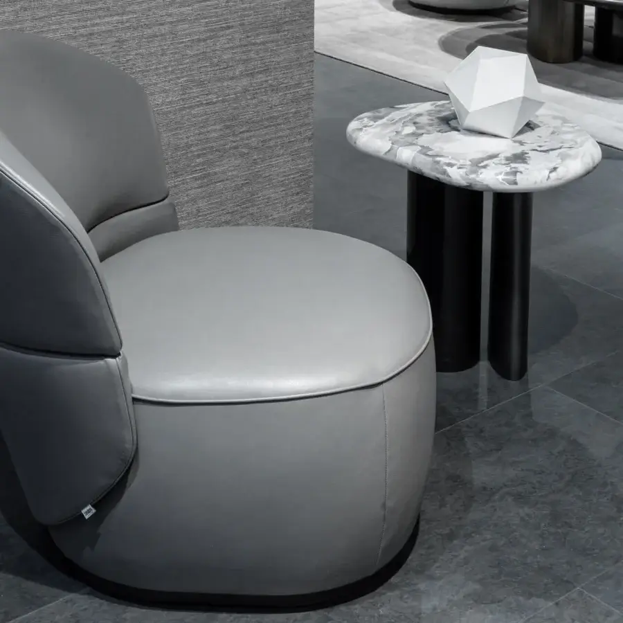 Superior Zanaboni Alma lounge chair with smooth medium-gray fabric upholstery and continuous balanced form