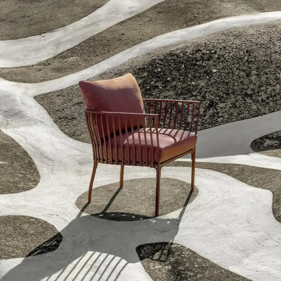 Elegant Ethimo Venexia lounge chair with a comfortably enveloping form upholstered in rose-toned textile and satin aluminum frame