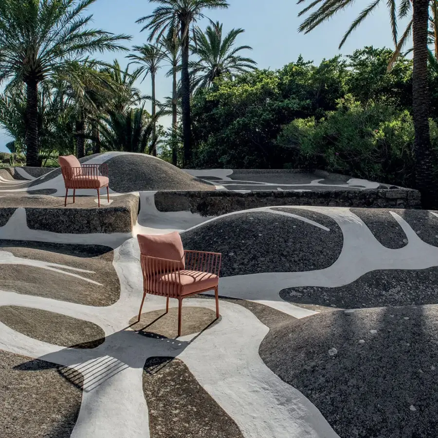 Distinguished Ethimo Venexia lounge chair with terracotta textile and skillfully crafted aluminum slats inspired by Venetian garden railings