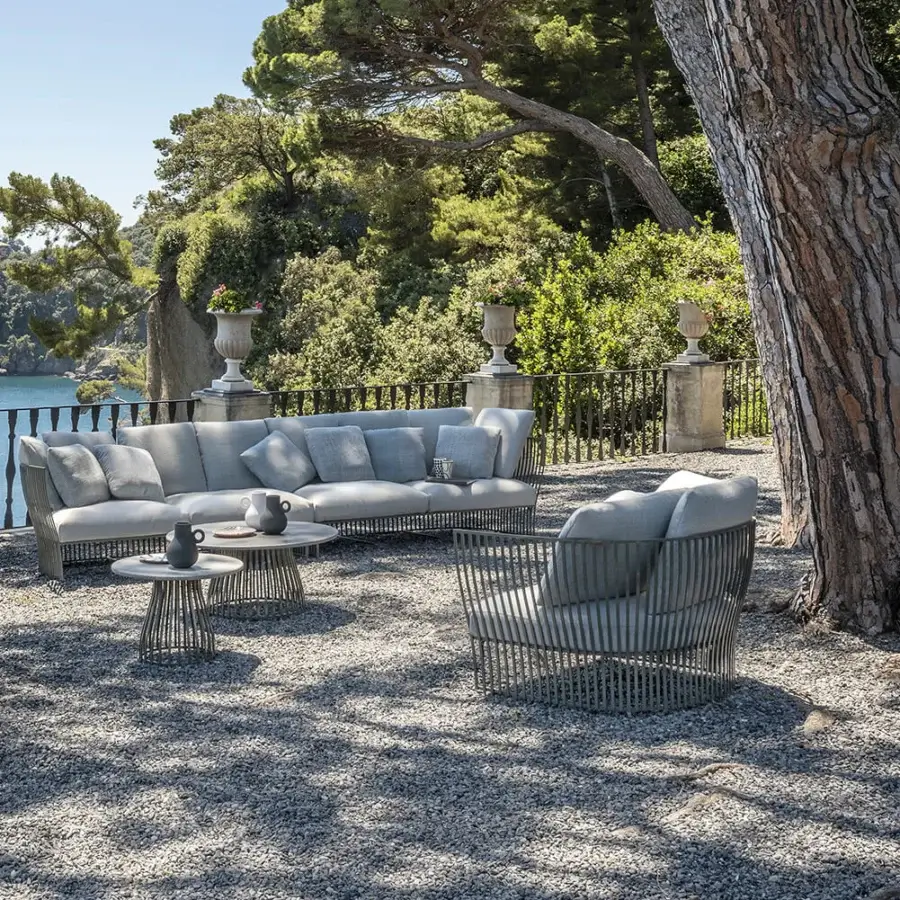 Distinguished Ethimo Venexia lounge chair with slender aluminum slats and woven gray synthetic material construction