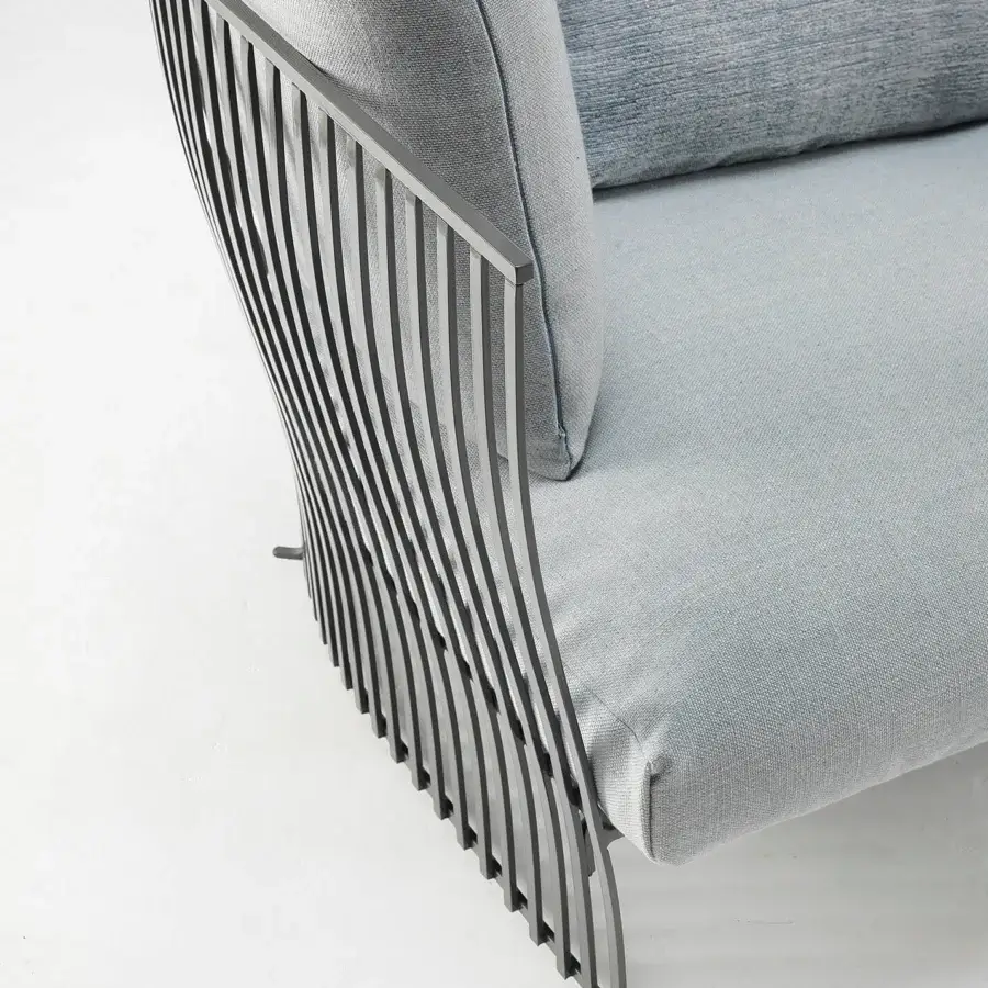 Captivating Ethimo Venexia lounge chair with aluminum slats and plush textile cushioning in a muted gray-blue hue