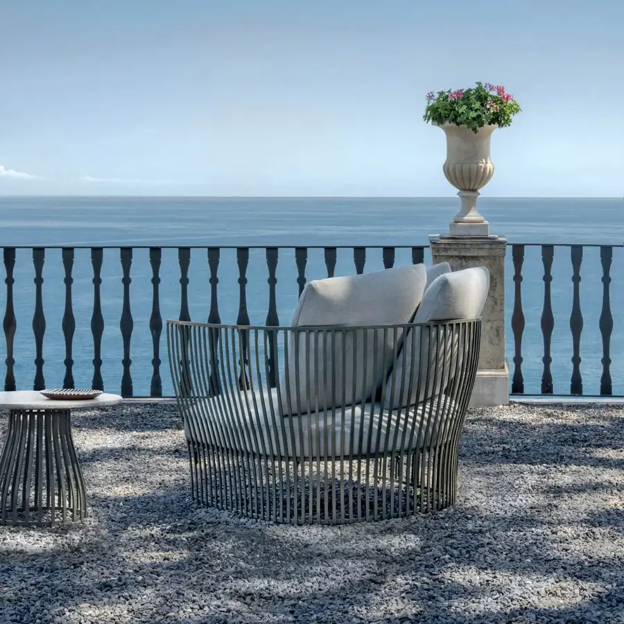 Distinguished Ethimo Venexia lounge chair with woven aluminum slats and light gray upholstery crafted in Italy