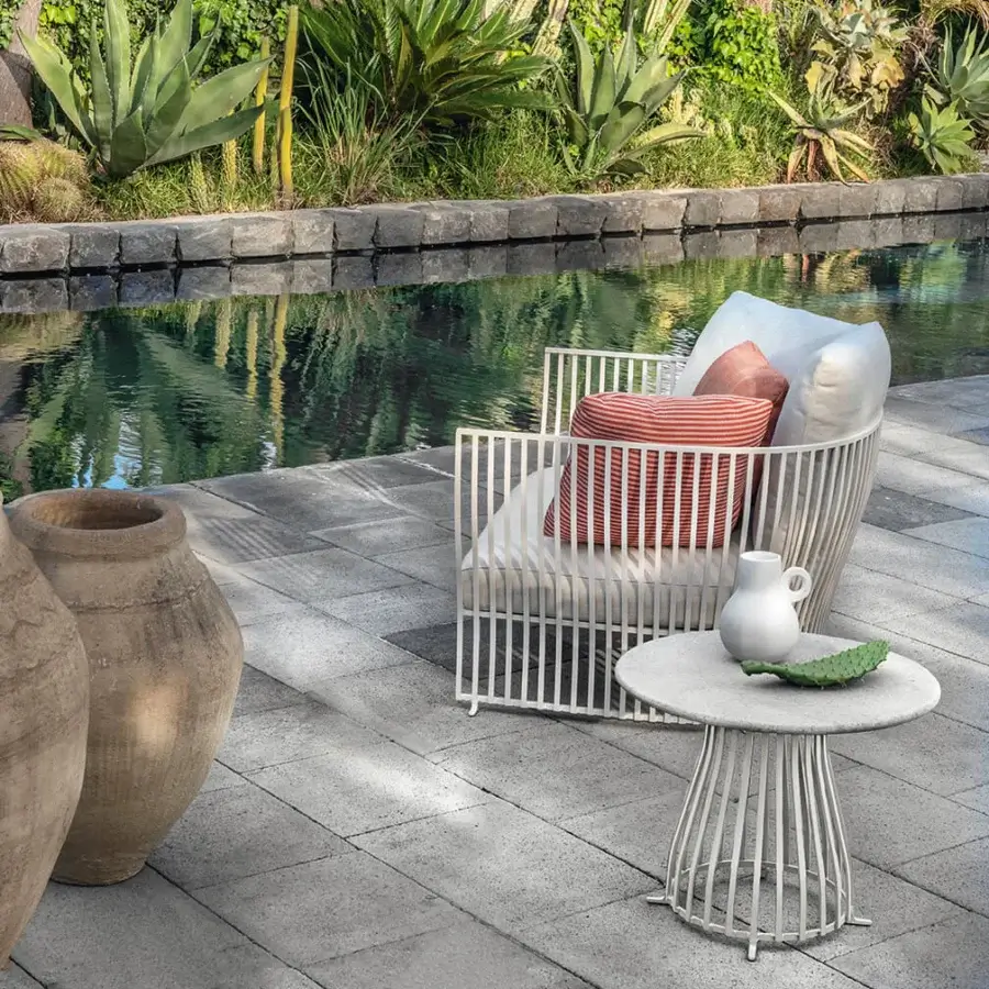 Captivating Ethimo Venexia lounge chair with aluminum frame and cushions in red and white striped patterns