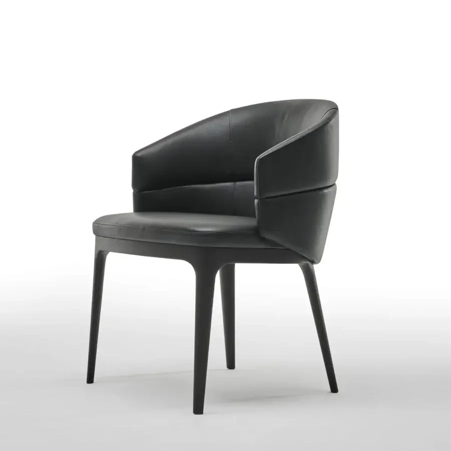 Exceptional Zanaboni Alma armchair in smooth black leather with a robust ash wood base and sinuous lines