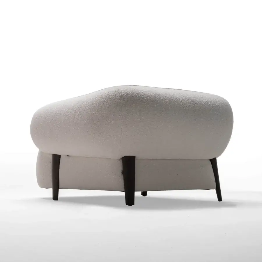 Innovative Zanaboni Carol lounge chair crafted with wood and fully upholstered in textured neutral textile for comfortable relaxation