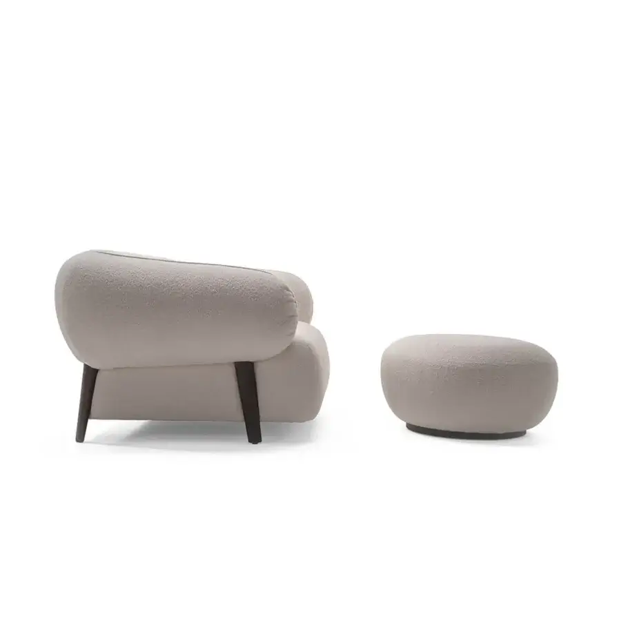 Distinguished Zanaboni Carol lounge chair built with wood and upholstered in textured neutral beige textile