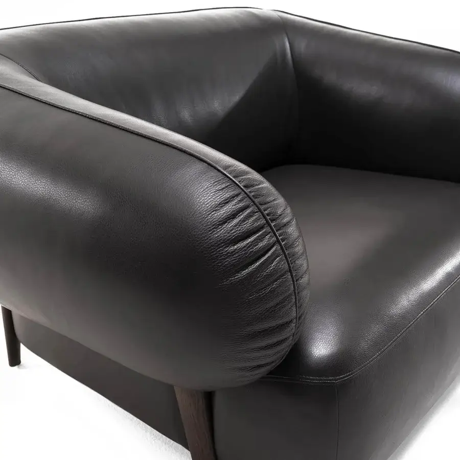 Exceptional Zanaboni Carol lounge chair with subtly textured matte-finish leather and dark-toned wood base