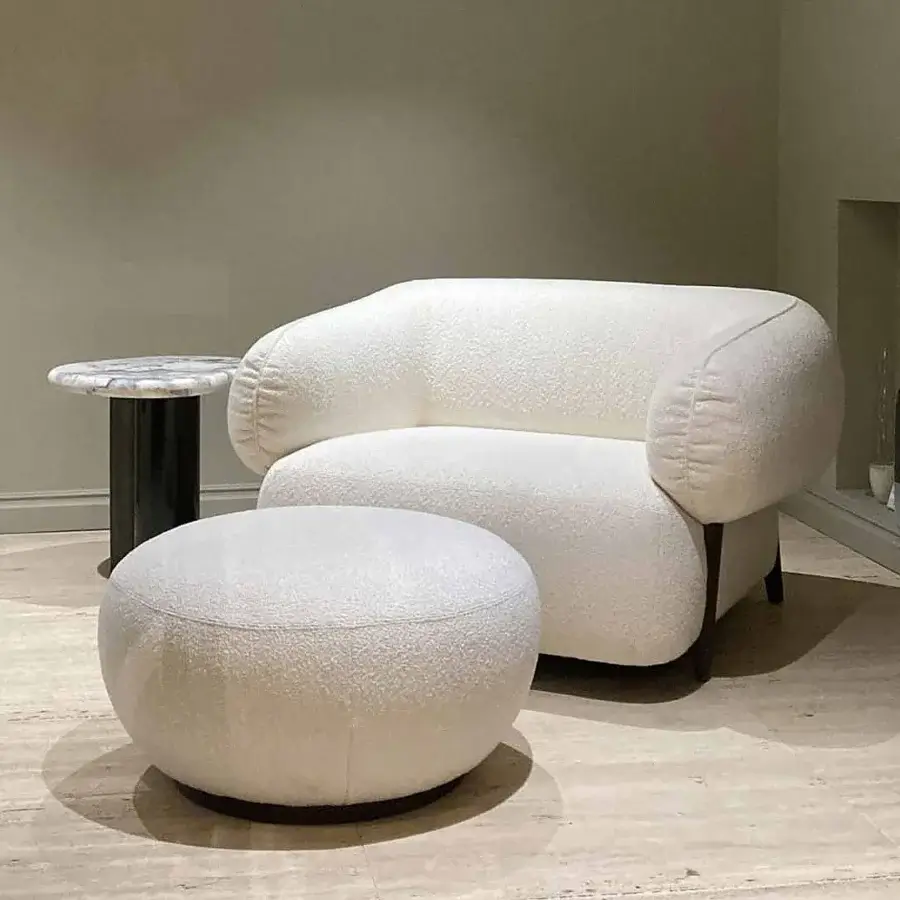 Exceptional Zanaboni Carol ottoman crafted in Italy with textured creamy off-white textile and rounded form