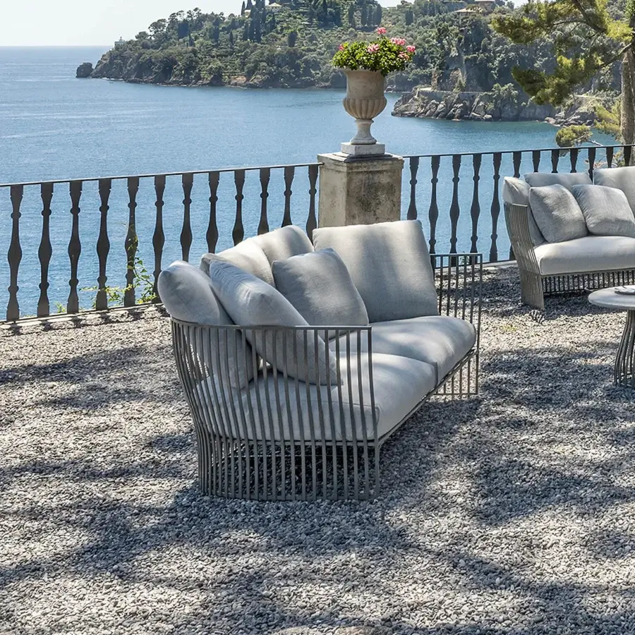 Distinguished Ethimo Venexia sofa crafted in Italy with a matte aluminum frame and soft textured light gray cushions