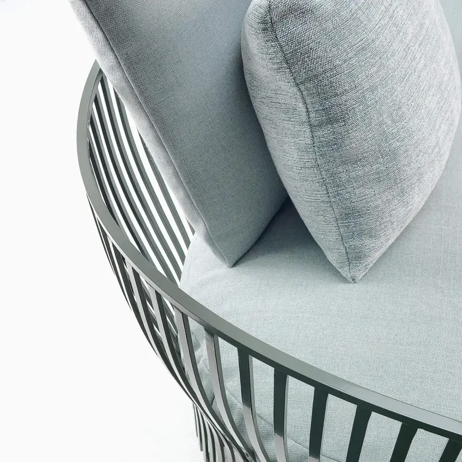 Elegant Ethimo Venexia sofa with a dark gray aluminum frame and textured light gray cushions embodies al fresco well-being crafted in Italy