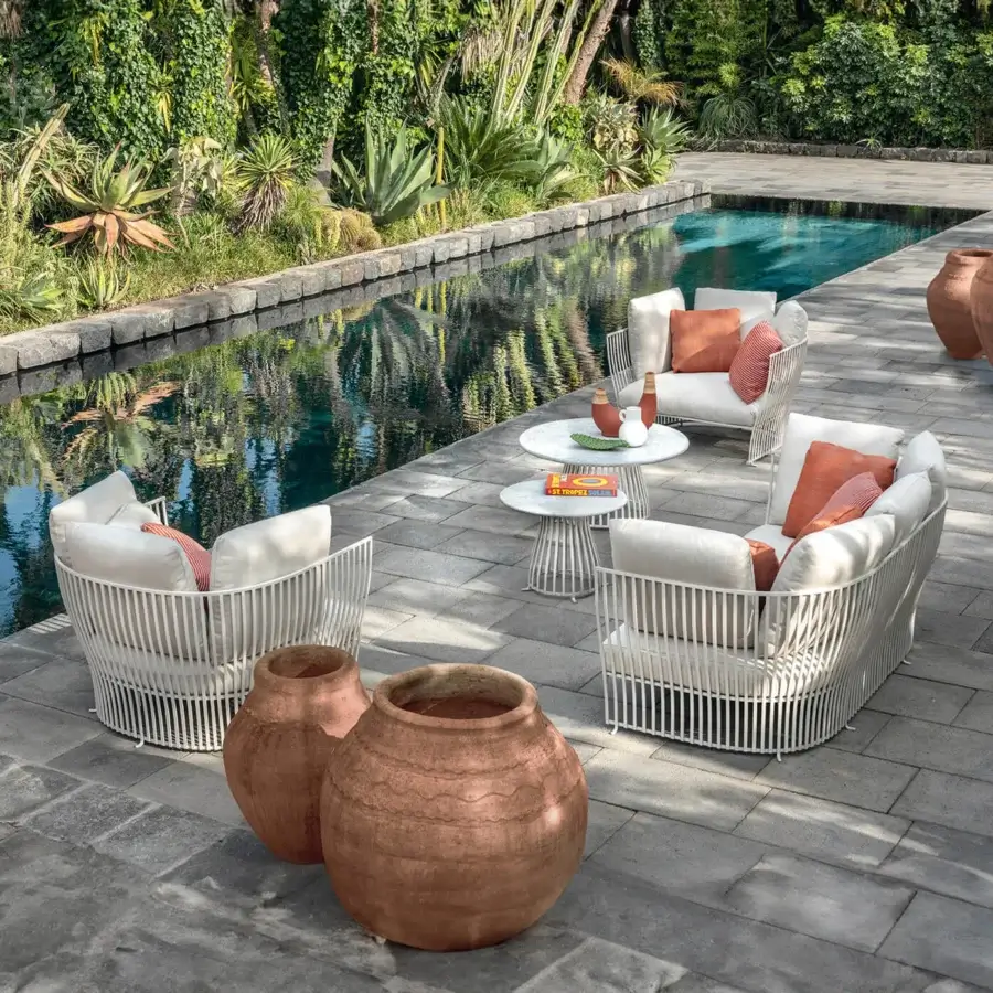 Superior Ethimo Venexia sofa crafted with a thin aluminum slat frame and lavish cushions in light beige woven texture with terracotta accents