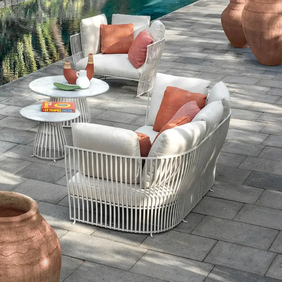 Captivating Ethimo Venexia sofa with a woven matte aluminum frame and oversized terracotta high-performance cushions