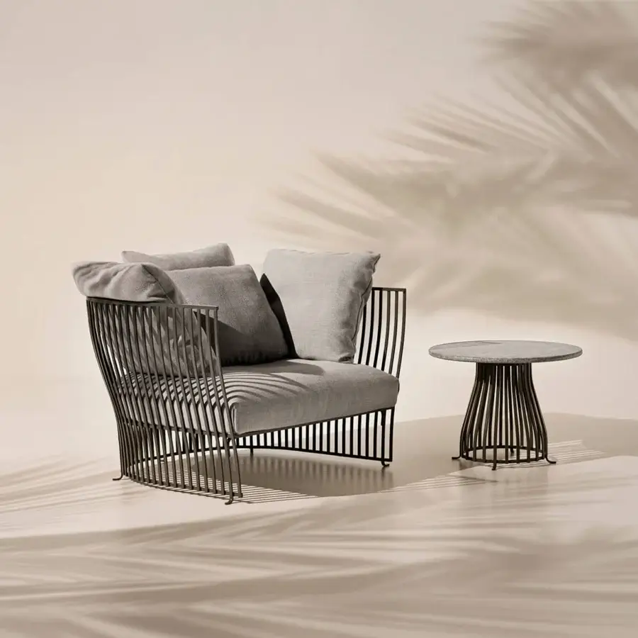 Distinctive Ethimo Venexia coffee table with woven aluminum base and grounded stone tabletop in matte dark gray finish