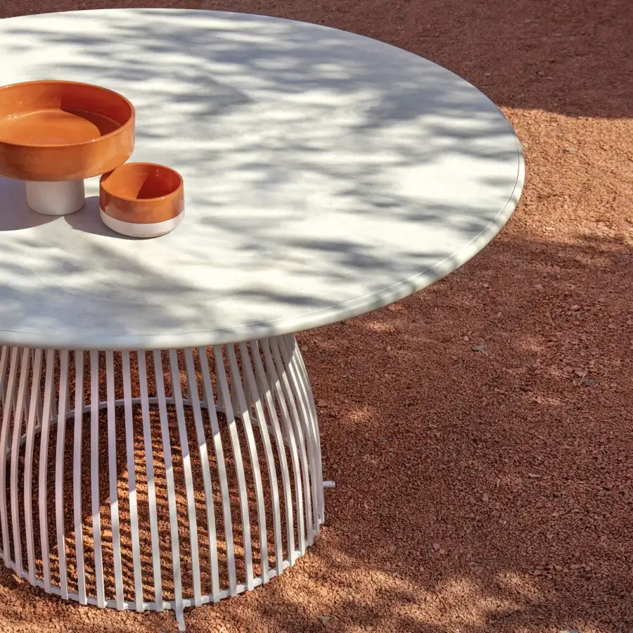 Captivating Ethimo Venexia table crafted in Italy with white-painted aluminum slats and matte white enamelled lava stone tabletop