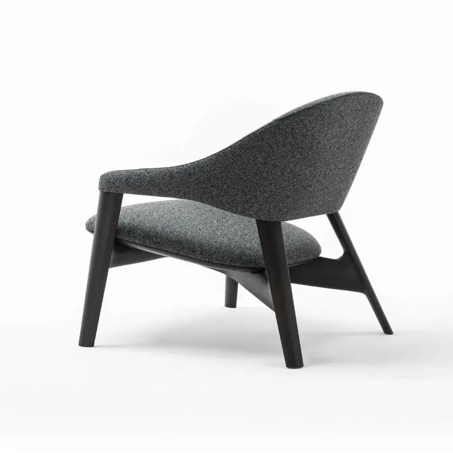 Superior Zanaboni Egle lounge chair built with sculpted solid wood and dark gray speckled textile upholstery with a nearly black tone