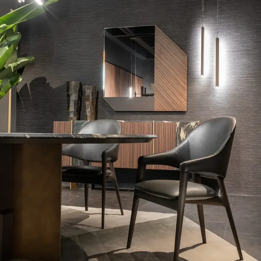Elegant Zanaboni Egle armchair with sculptural solid wood and premium leather upholstery in a deep black finish