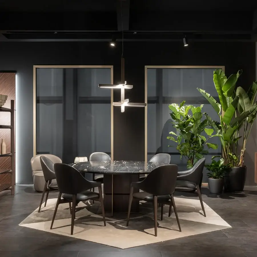 Superior Zanaboni Egle armchair crafted with sculptural solid wood and premium leather in a dark gray textile finish