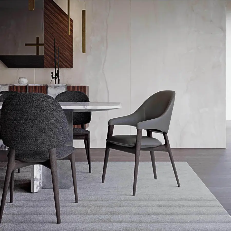 Exceptional Zanaboni Egle armchair built with sculptural solid wood and premium muted gray leather upholstery with matte finish