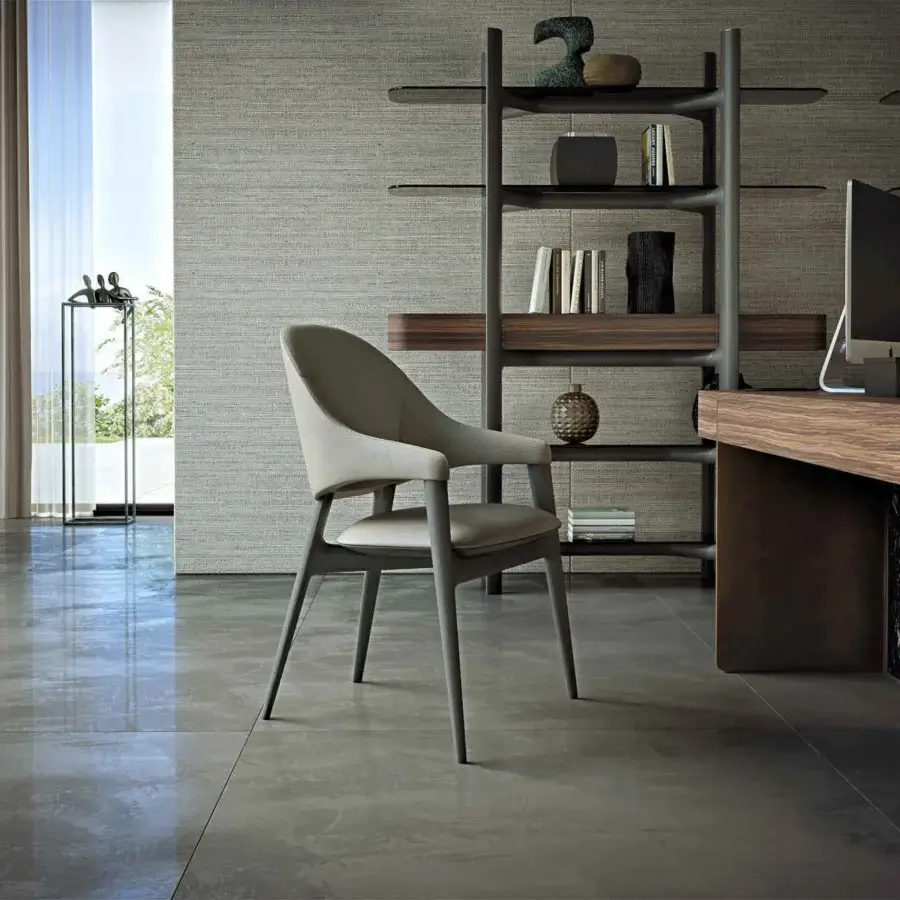 Superior Zanaboni Egle armchair built with sculptural solid wood and premium leather upholstery in a neutral beige-grey tone with a satin metal frame
