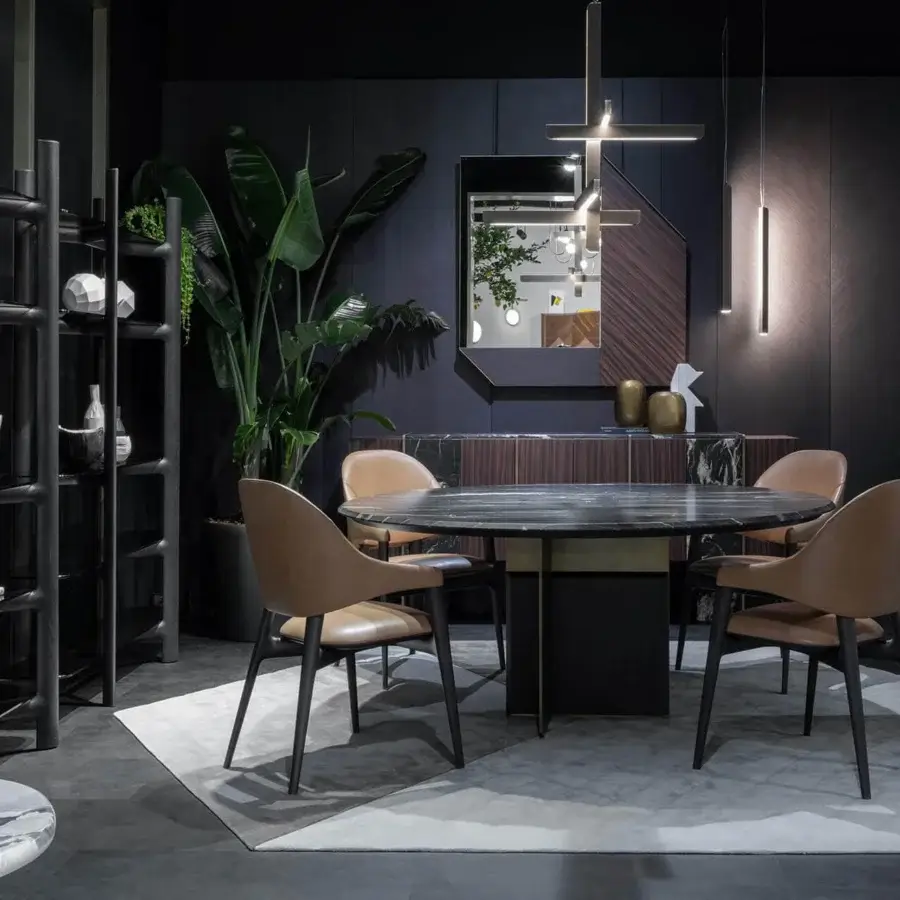 Architectural Zanaboni Kalos table with dark stone-like veining and glossy polished finish built with contrasting matte metal legs