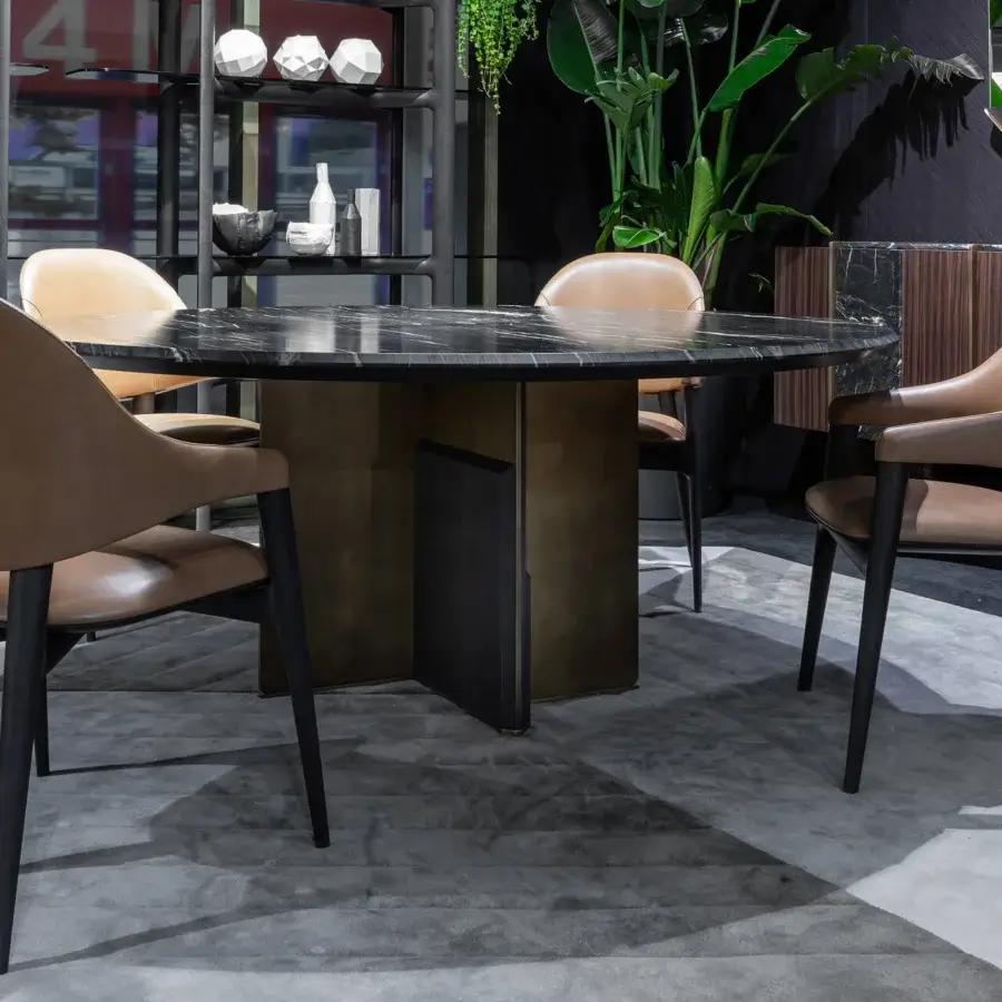 Distinguished Zanaboni Kalos table with glossy black stone tabletop and matte finish wooden base exhibiting visible grain