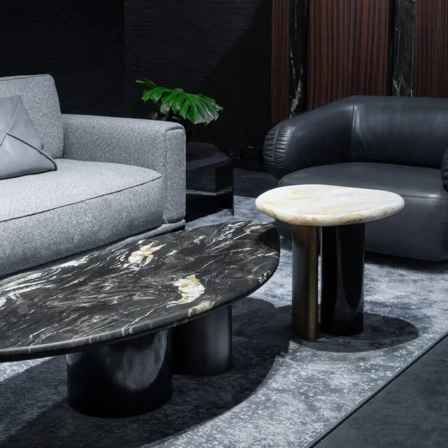 Distinctive Zanaboni Cloud side table crafted in Italy with black marble displaying white and grey veining and brushed metal with cloudy silver finish