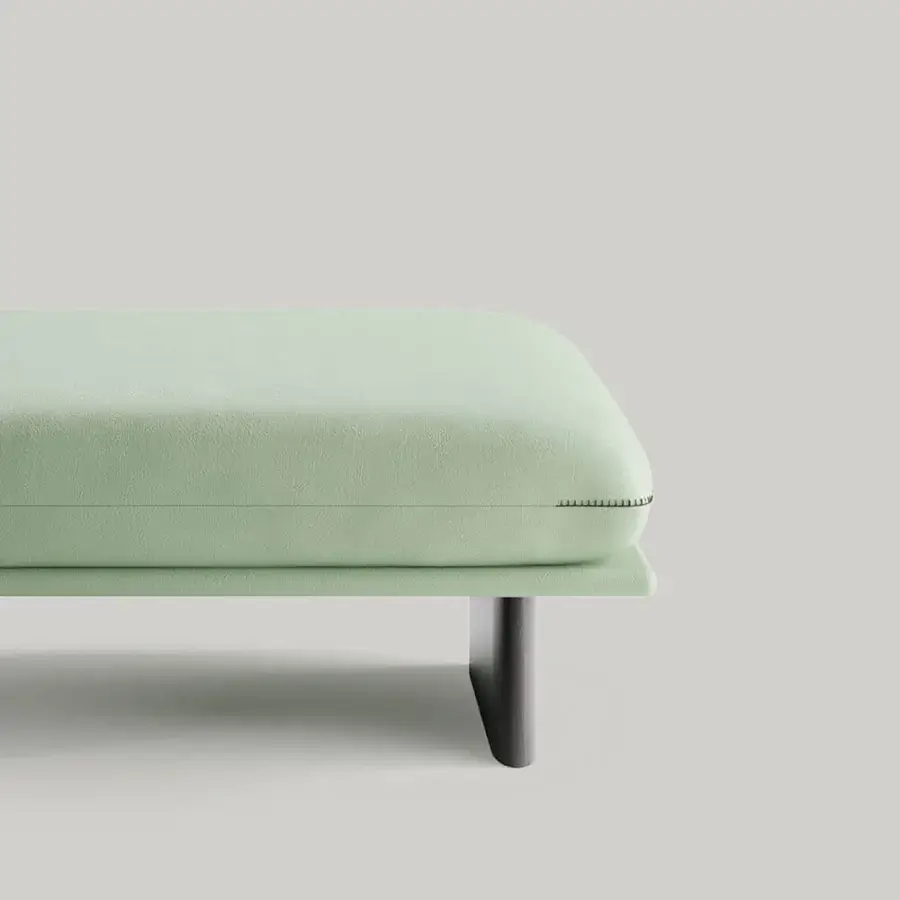 Distinguished Borzalino Connor ottoman with light green textile upholstery and sleek dark-toned wood sled base crafted in Italy