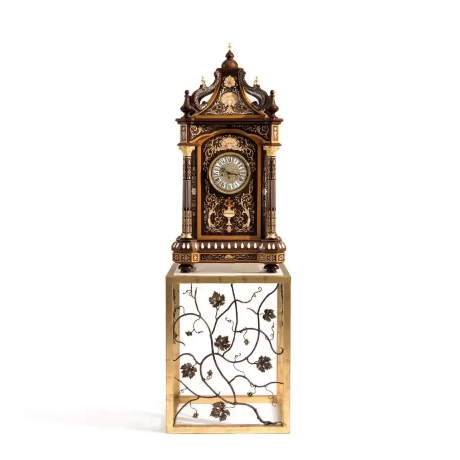 Lavish Armando Rho A1427 clock crafted in California walnut burl with inlaid details and gilded accents