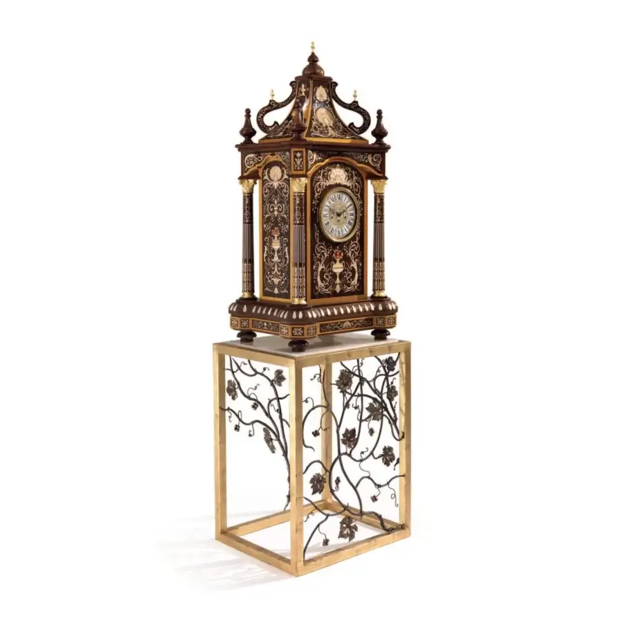 Distinguished Armando Rho A1427 clock crafted in California walnut burl with finely executed inlays and a contrasting metal base