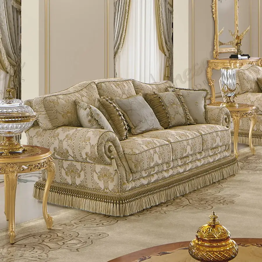 Distinguished Modenese Royal Blend sofa upholstered in cream and gold patterned fabric with satin finish and tassel fringe
