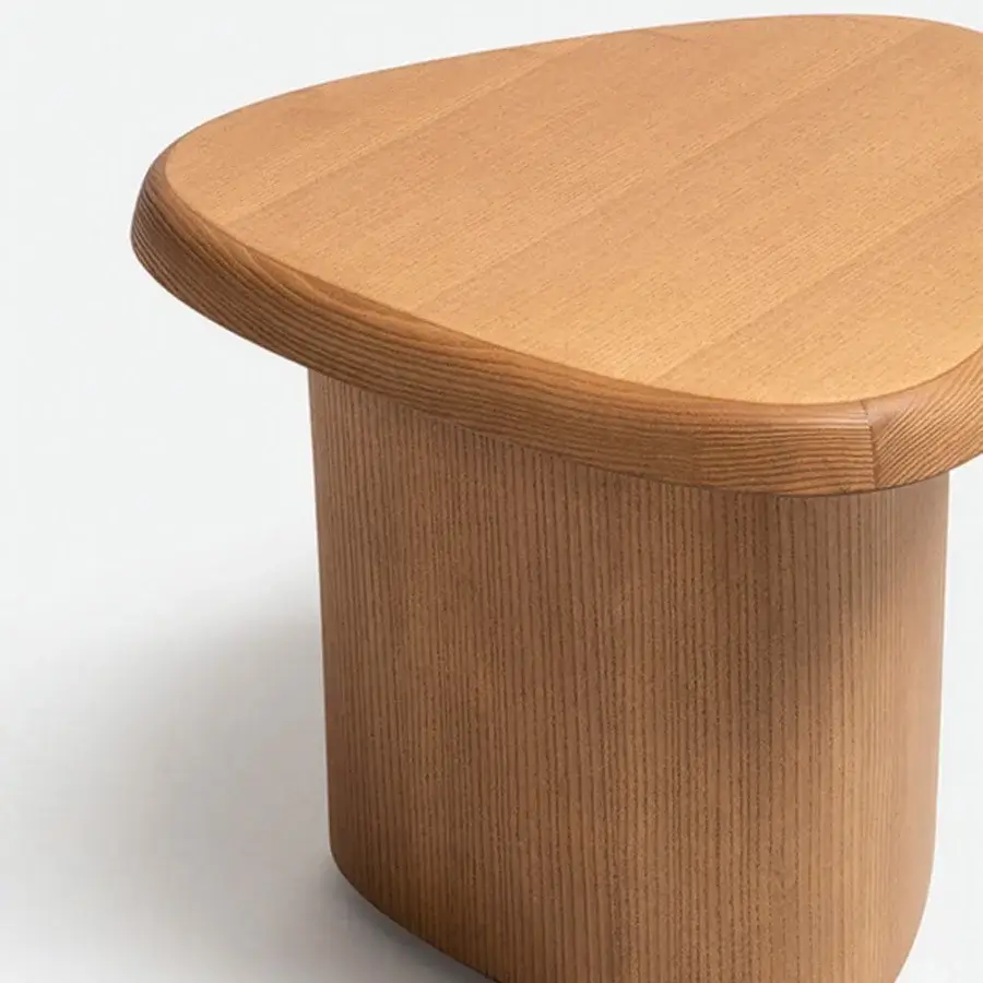 Distinguished Carpanese Home Bitt side table built in Italy from solid wood with a satin finish and asymmetrical form