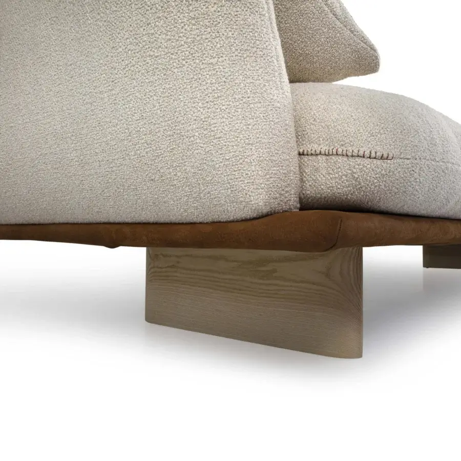 Superior Borzalino Connor sectional with plush beige upholstery and a contrasting brown base with light-colored wood legs