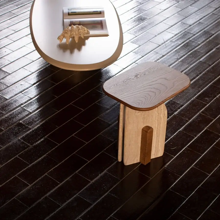 Exceptional Carpanese Home Slabs side table crafted in stone composite and dark-toned wood with matte and satin finishes