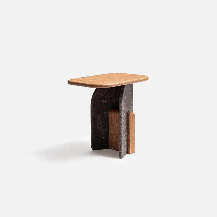Architectural Carpanese Home Slabs side table crafted with warm brown wood and dark gray stone-like material in Italy