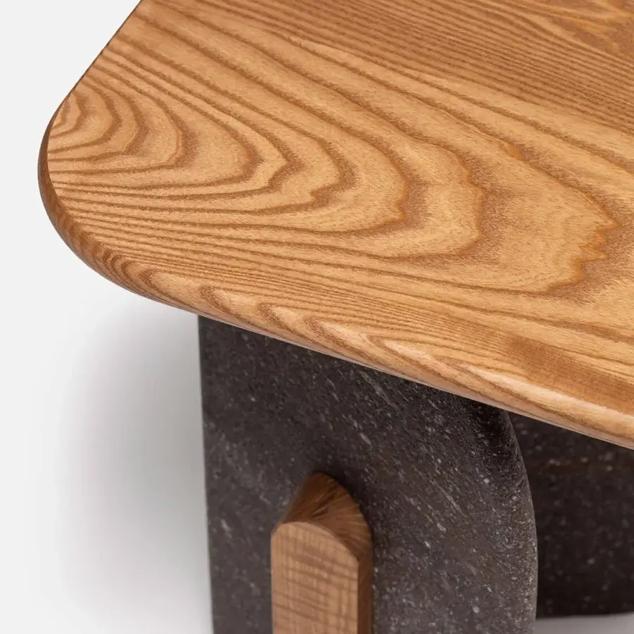 Architectural Carpanese Home Slabs side table crafted in wood and dark granular stone-like material with satin finish