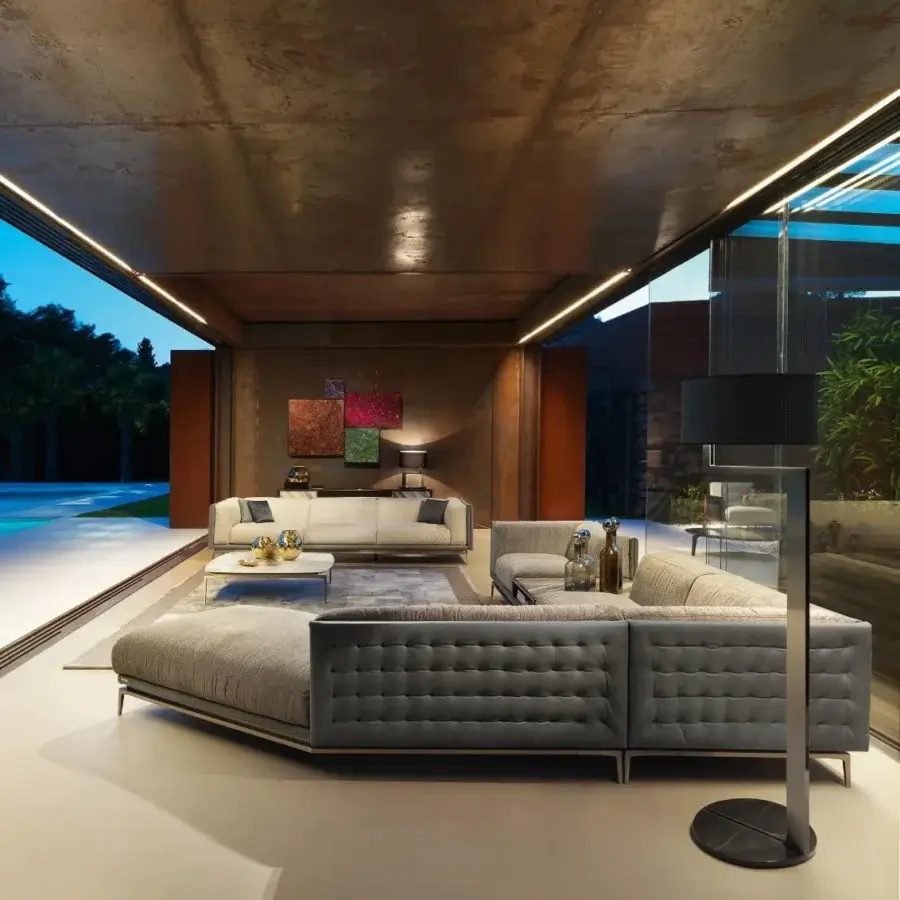 Lavish Visionnaire Legend sofa with quilted gray textile upholstery and satinized stainless steel base
