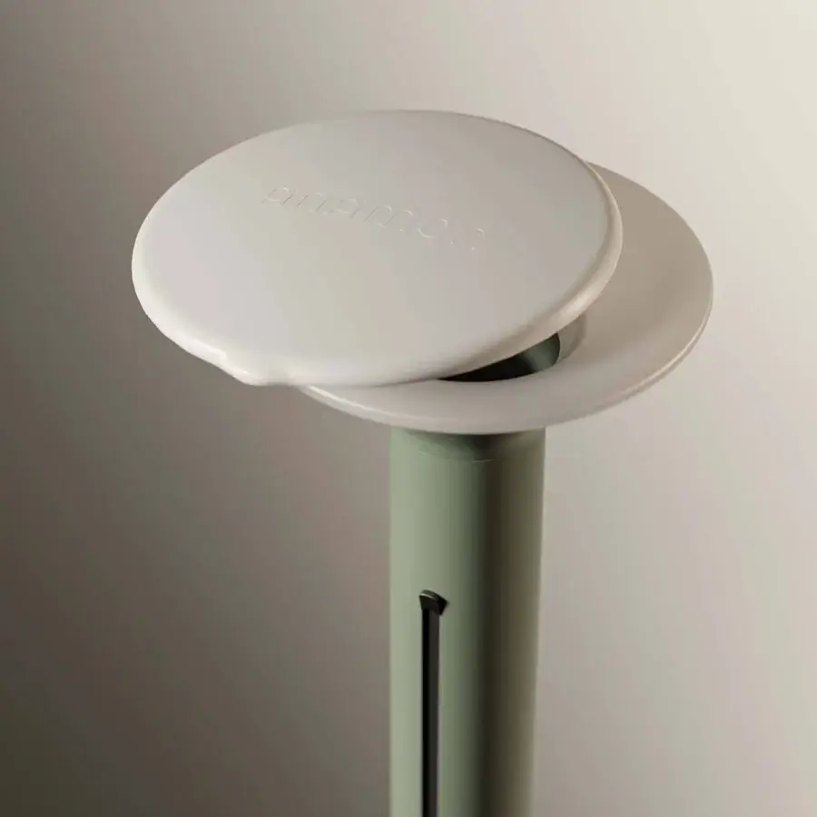 Distinguished Royal Botania Anamon sunshade crafted with matte synthetic material in sage green and a light grey-white disc with logo