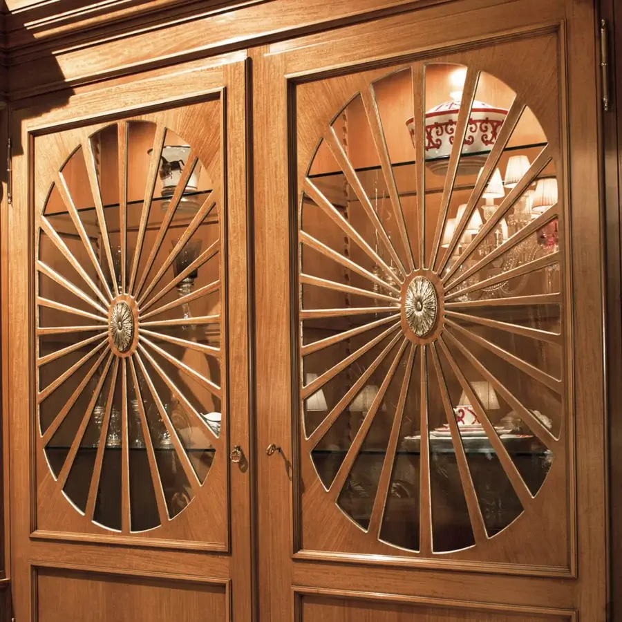 Architectural Provasi 1221 bookcase crafted in noble wood with warm brown finish and ornate brass details
