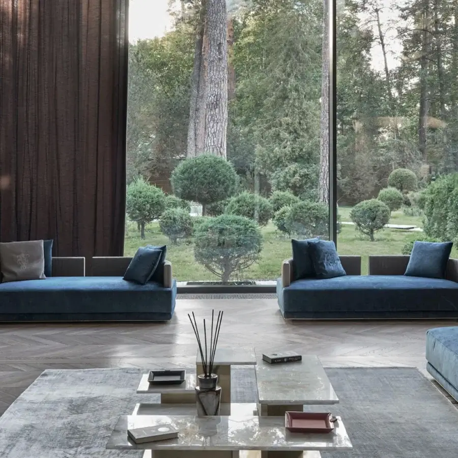 Distinguished Visionnaire Miller Unicum sofa built with a wooden frame and satin black nickel aluminum base, upholstered in luxurious teal blue quilted fabric
