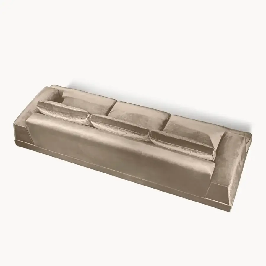 Architectural Visionnaire Xavier sofa upholstered in luminous gold-toned velvet textile with a subtle satin finish