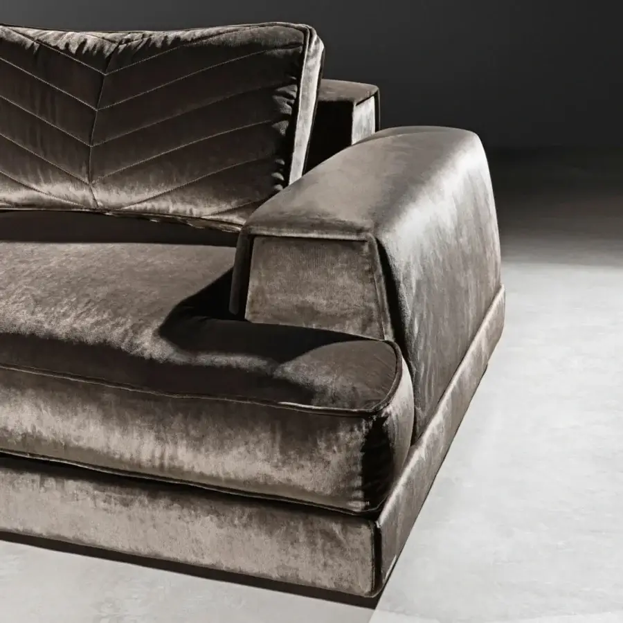 Architectural Visionnaire Xavier sofa upholstered in grayish-brown plush velvet with chevron back cushions and a sleek platform base