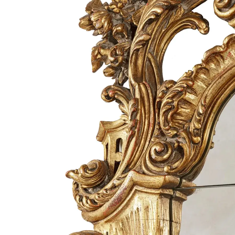 Exquisite Provasi 0770 mirror crafted in Italy with gold-toned carved wood, fluid C-scrolls and delicate floral motifs