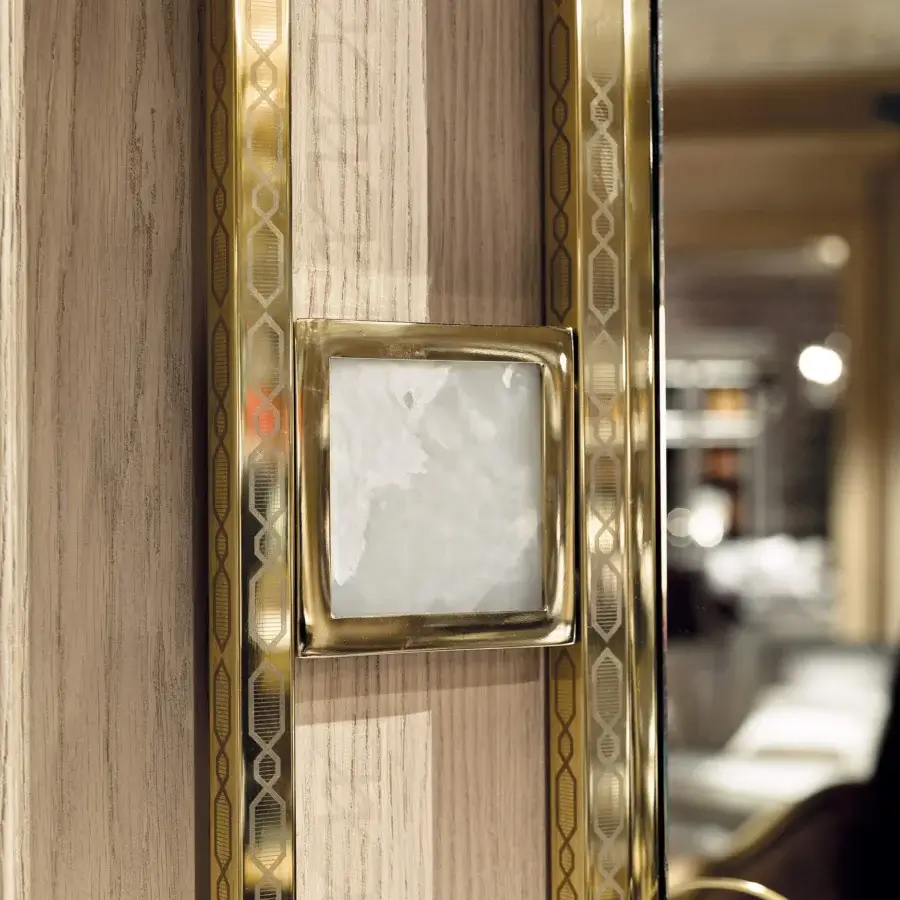 Lavish Provasi 1607 mirror with brass frame and integrated marble details in warm wood with polished gold geometric patterns