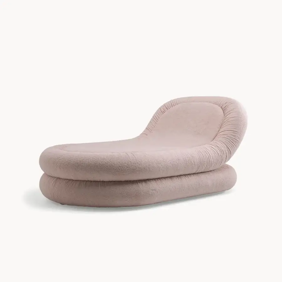 Cutting-edge Visionnaire Fedro chaise lounge with curved silhouette upholstered in textured dusty rose textile and open cell polyurethane cushioning